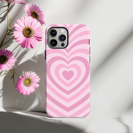 Phone case with pink heart pattern on a light background with flowers