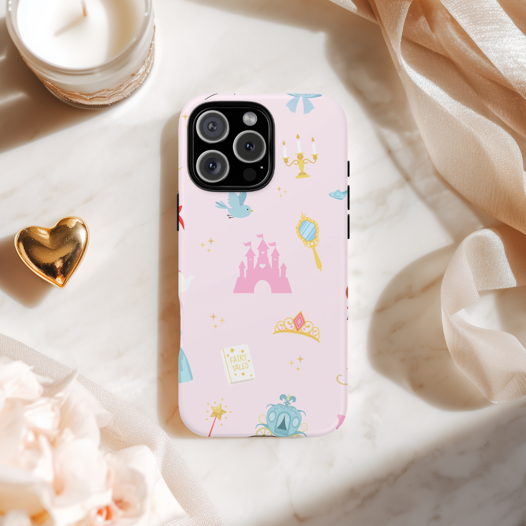 Phone case with fairy tale design on a marble surface with decorative items