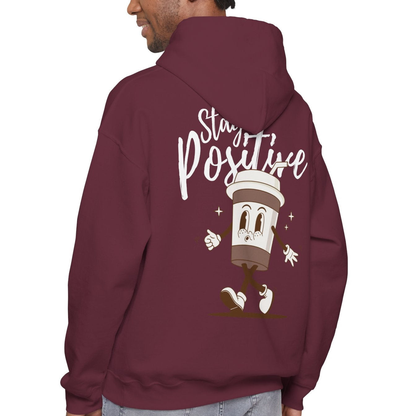 Person wearing a maroon hoodie with 'Stay Positive' text and graphic on the back, on a white background
