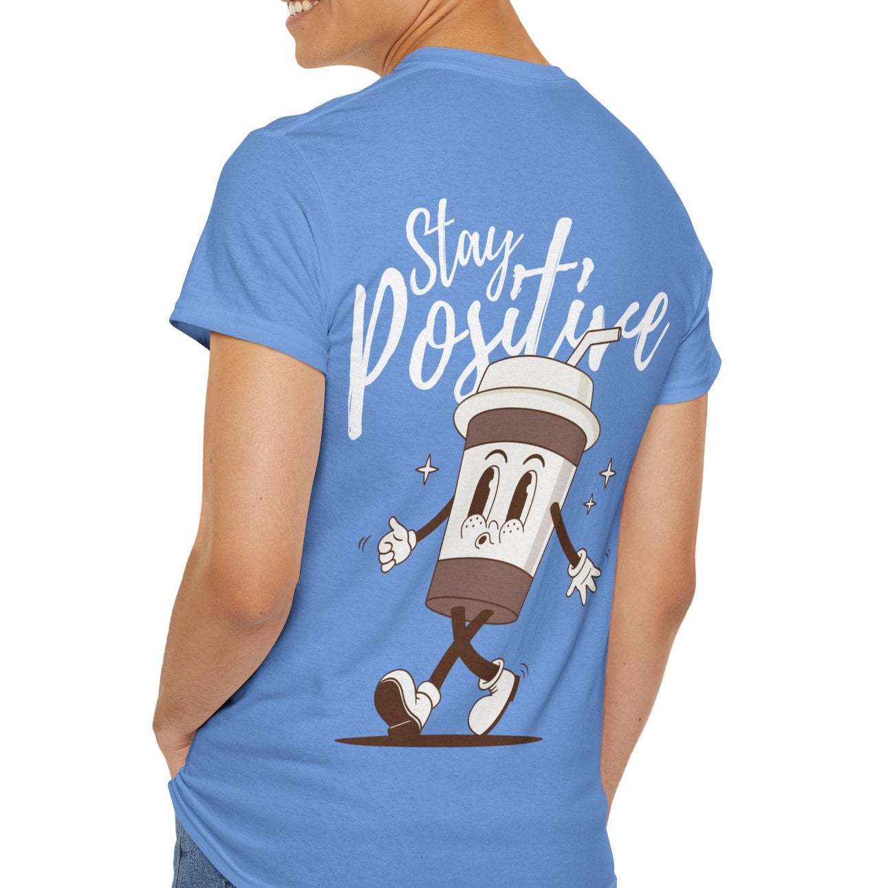 Person wearing a blue t-shirt with a cartoon character and 'Stay Positive' text on the back.