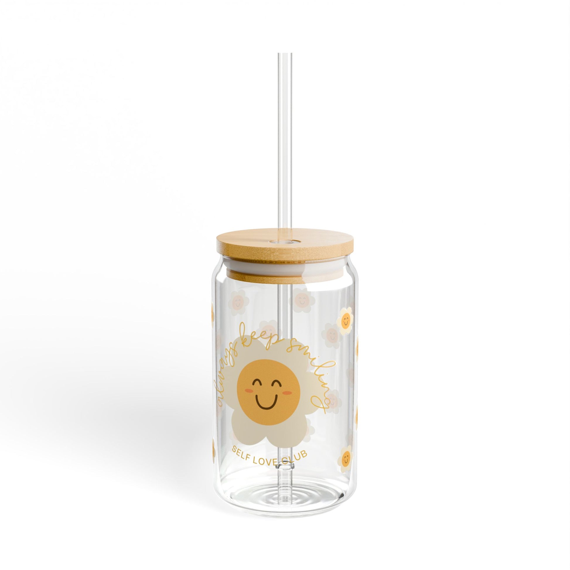 Clear tumbler with a happy flower design and wooden lid on a white background