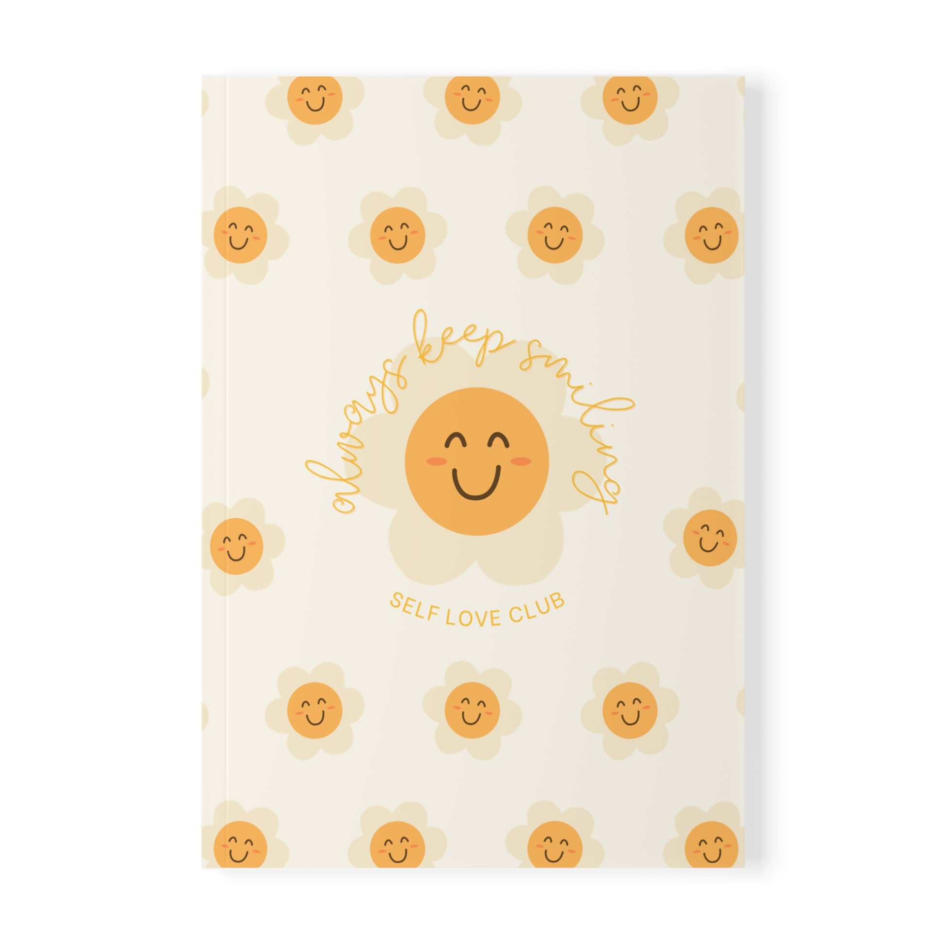 Notebook with happy flower face design and text on a white background