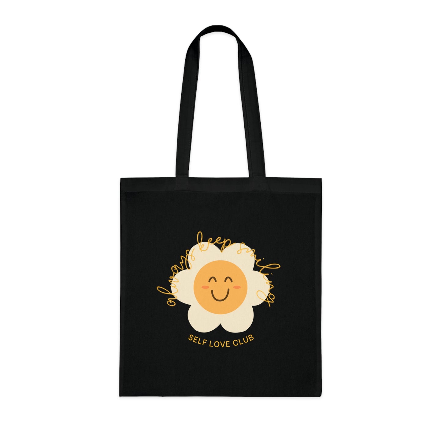Black tote bag with a smiling flower design and 'Self Love Club' text on a white background