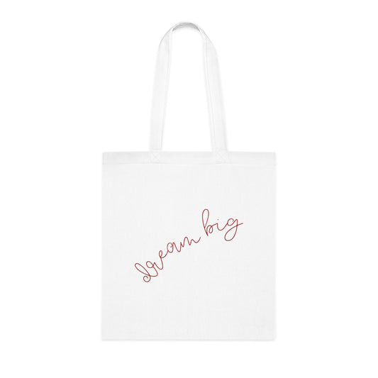 White tote bag with 'Dream Big' text on a white background