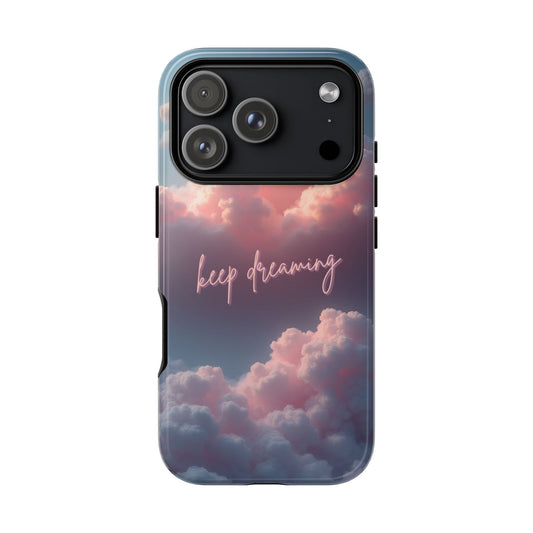 Phone case with cloud design and 'keep dreaming' text on a white background